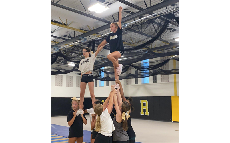 Cheer team practices routine for upcoming season--Go Falcons!